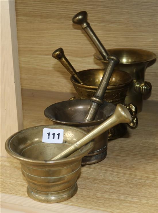 Four bronze mortars and pestles tallest 12.5cm